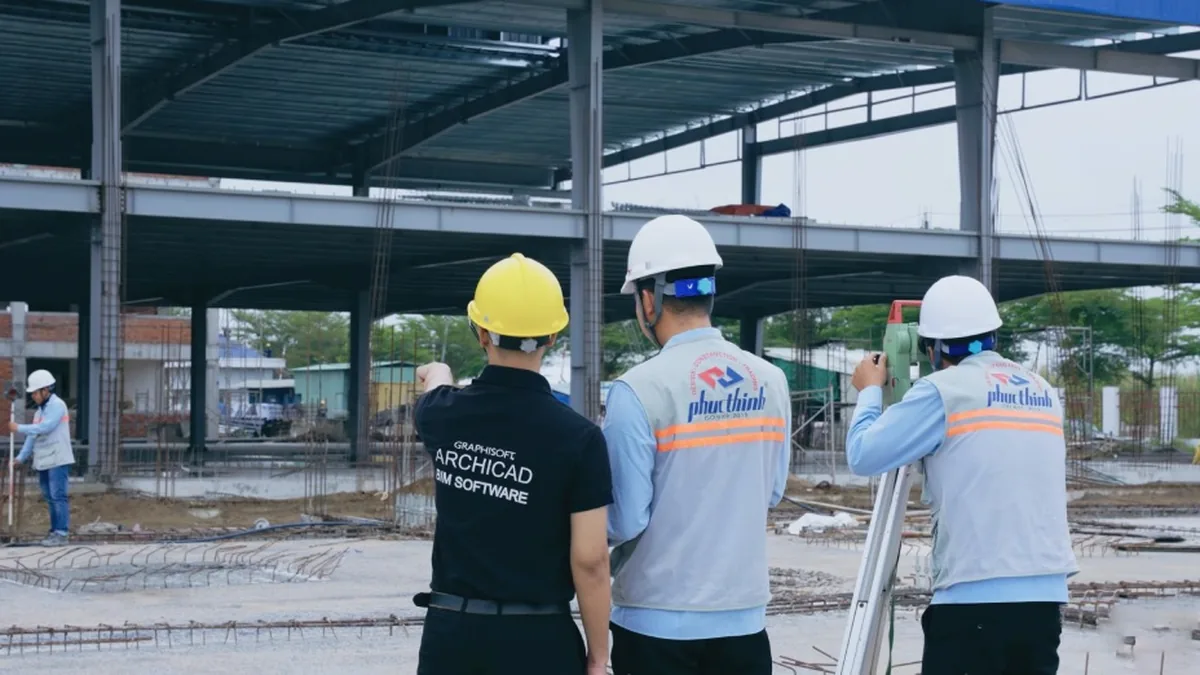 Filming GreenDS engineers surveying the construction site.