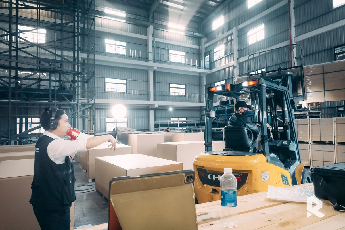 Filming the finished product packaging area at the Fletcher factory.