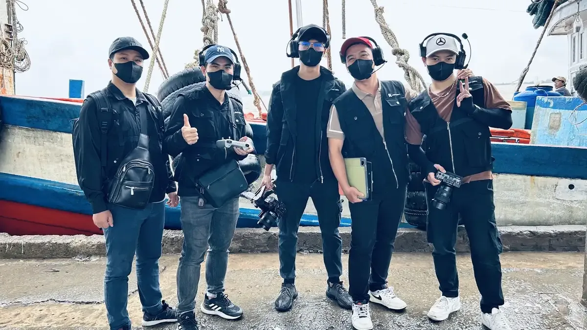 The Right Media team at the fishing port with the Khanh Hoang fleet.