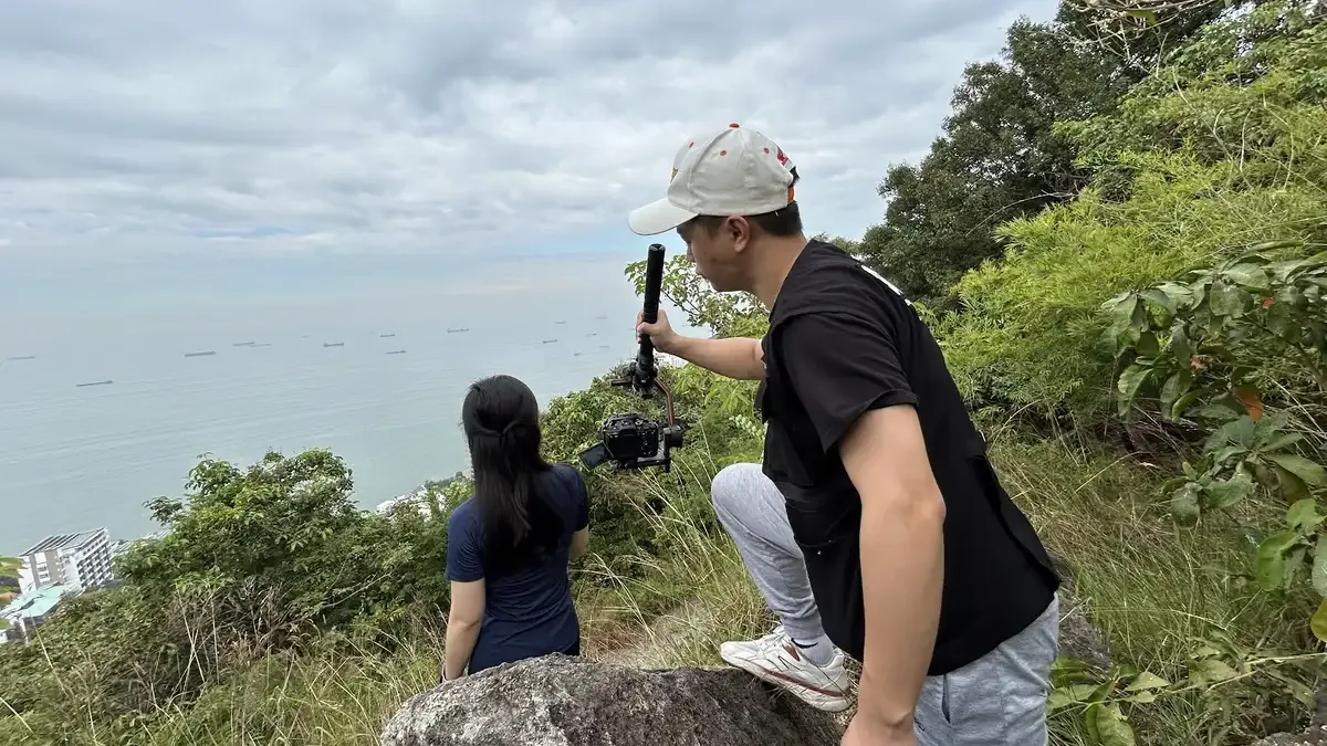 Behind the scenes of Mai Phu Hung's brand photoshoot in a coastal setting.
